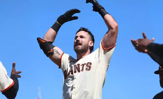 San Francisco Giants' Bryce Eldridge celebrates after hitting a game winning grand slam against the Washington Nationals during the ninth inning of a baseball game in San Francisco, Wednesday, June 10, 2026. (AP Photo/Jed Jacobsohn)