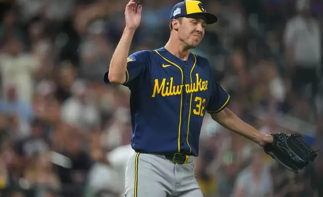 Milwaukee Brewers starting pitcher Jacob Misiorowski reacts after getting out of a bases-loaded jam after Colorado Rockies' Ezequiel Tovar grounded out to end the sixth inning of a baseball game Saturday, June 6, 2026, in Denver. (AP Photo/David Zalubowski)