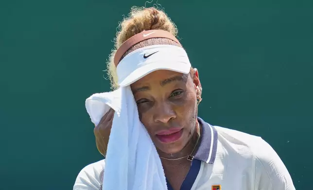 Serena Williams of the United States wipes sweat during a practice session ahead of the Wimbledon Tennis Championships, in London, Wednesday, June 24, 2026. (AP Photo/Kin Cheung)