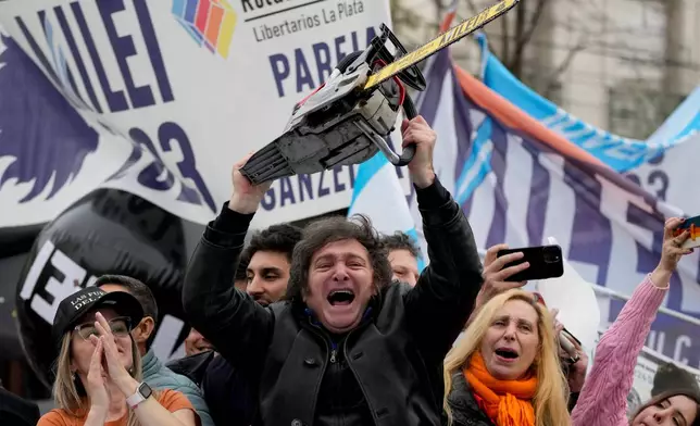 FILE - Presidential hopeful of the Liberty Advances coalition Javier Milei brandishes a chainsaw during a rally in La Plata, Argentina, Sept. 12, 2023.(AP Photo/Natacha Pisarenko, File)