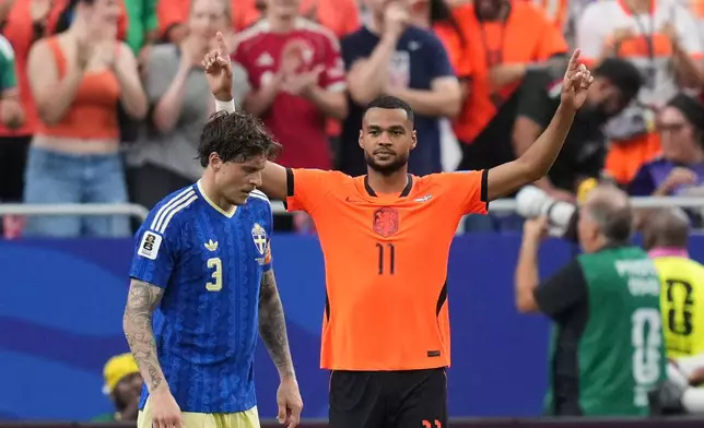 Netherlands' Cody Gakpo celebrates scoring his side's third goal against Sweden during a World Cup Group F soccer match in Houston, Saturday, June 20, 2026. (AP Photo/Eric Gay)