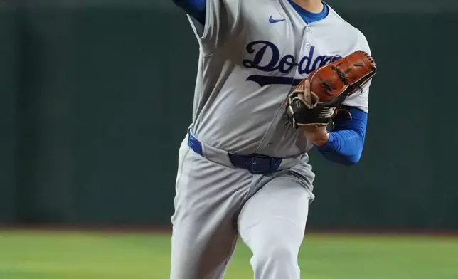 Los Angeles Dodgers pitcher Shohei Ohtani throws against the Arizona Diamondbacks in the first inning of a baseball game, Wednesday, June 3, 2026, in Phoenix. (AP Photo/Rick Scuteri)