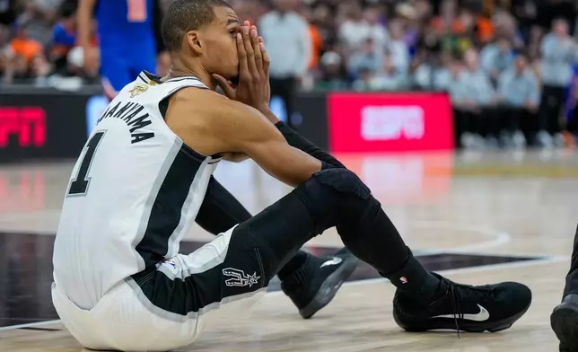 San Antonio Spurs forward Victor Wembanyama reacts after a foul call during the second half of Game 5 of the NBA Finals basketball series against the New York Knicks, Saturday, June 13, 2026, in San Antonio. (AP Photo/Ross D. Franklin)