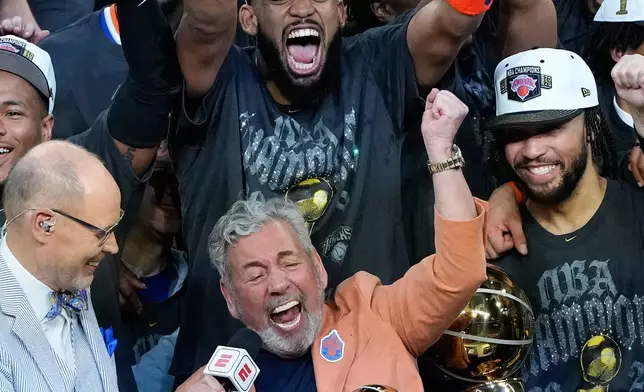 New York Knicks owner James L. Dolan celebrates with his players after defeating the San Antonio Spurs in Game 5 of the NBA Finals basketball series, Saturday, June 13, 2026, in San Antonio. (AP Photo/Ross D. Franklin)