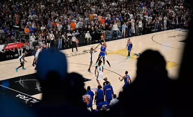 New York Knicks guard Josh Hart (3) shoots against the San Antonio Spurs during the first half of Game 5 of the NBA Finals basketball series, Saturday, June 13, 2026, in San Antonio. (AP Photo/Darren Abate)