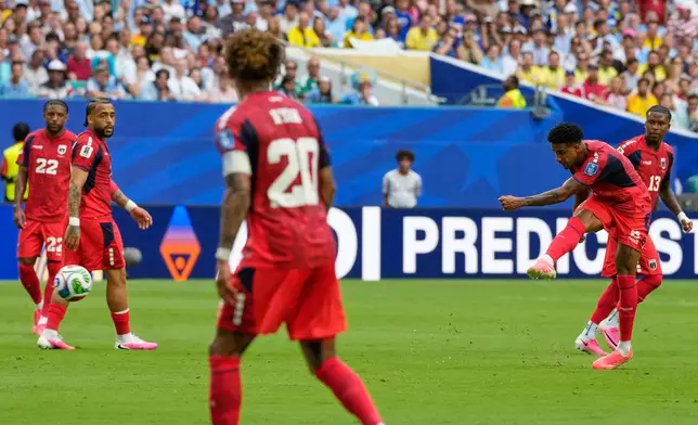 Cape Verde's Kevin Pina, second right, scores his team's first goalduring the World Cup Group H soccer match between Uruguay and Cape Verde in Miami Gardens, Fla., Sunday, June 21, 2026. (AP Photo/Rebecca Blackwell)