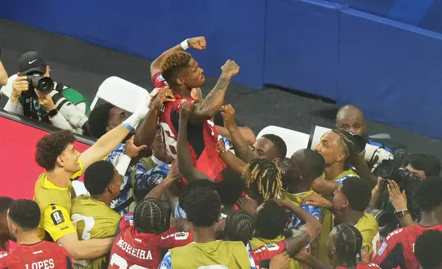 Cape Verde's Helio Varela, top, celebrates scoring his side's second goal against Uruguay during the World Cup Group H soccer match in Miami Gardens, Fla., Sunday, June 21, 2026. (AP Photo/Marta Lavandier)