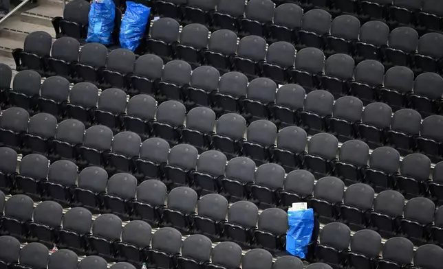 Bags of trash collected by Japan fans sits in the empty stands following the World Cup Group F soccer match between the Netherlands and Japan in Arlington, Texas, near Dallas, Sunday, June 14, 2026. (AP Photo/Jessica Tobias)