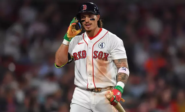 Boston Red Sox's Jarren Duran returns to the dugout after he struck out swinging in the eighth inning of a baseball game against the Baltimore Orioles, Tuesday, June 2, 2026, in Boston. (AP Photo/Steven Senne)