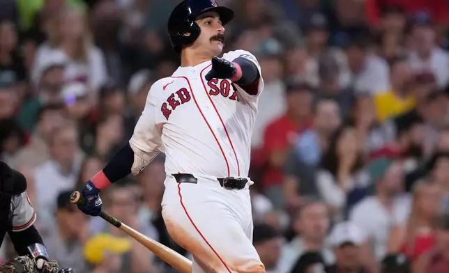 Boston Red Sox's Mickey Gasper watches the flight of his two-run triple during the fifth inning of a baseball game against the Baltimore Orioles, Wednesday, June 3, 2026, in Boston. (AP Photo/Charles Krupa)