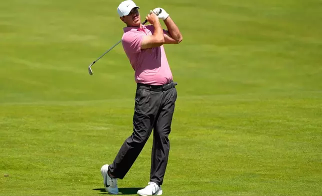 Brooks Koepka hits from the fairway on the 13th hole during a practice round for the U.S. Open golf tournament at Shinnecock Hills Golf Club in Southampton, N.Y., Tuesday, June 16, 2026.(AP Photo/Gerald Herbert)