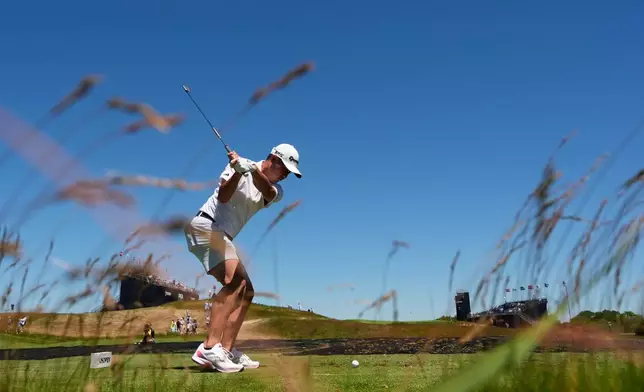 Collin Morikawa hits his tee shot on the 11th hole during a practice round for the U.S. Open golf tournament at Shinnecock Hills Golf Club in Southampton, N.Y., Monday, June 15, 2026.(AP Photo/David J. Phillip)