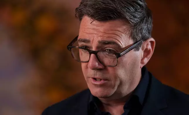 Andy Burnham speaks during an interview during a campaign visit to the town of Ashton-in-Makerfield before the forthcoming Makerfield by-election, in Greater Manchester, England, Tuesday, June 9, 2026. (AP Photo/Jon Super)