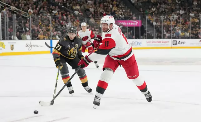 FILE - Carolina Hurricanes center Jordan Staal (11) shoots against Vegas Golden Knights center William Karlsson (71) during the third period of an NHL hockey game, Oct. 20, 2025, in Las Vegas. (AP Photo/Candice Ward, file)