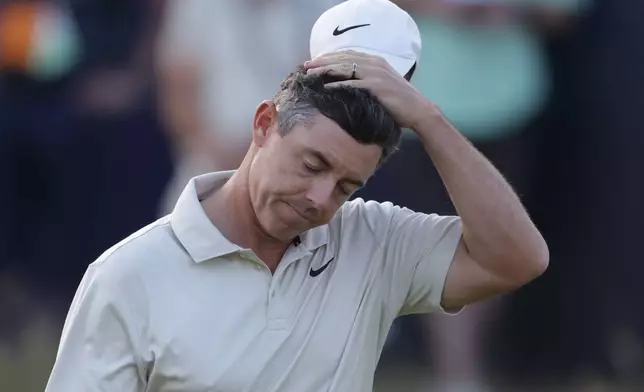 Rory McIlroy of Northern Ireland reacts after putting on the 18th green to complete his first round during the first day of the British Open Golf championships at Royal Birkdale golf club, in Southport, England, Thursday, July 16, 2026. (AP Photo/Peter Morrison)