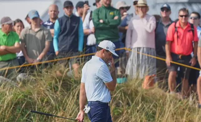 Jackson Suber of the United States looks down as he walks off the 7th green during the second day of the British Open Golf championships at Royal Birkdale golf club, in Southport, England, Friday, July 17, 2026. (AP Photo/Jon Super)