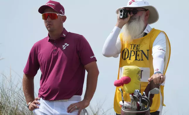 Lucas Herbert of Australia with his caddie Nick Pugh, look at the 13th hole from the tee during the second day of the British Open Golf championships at Royal Birkdale golf club, in Southport, England, Friday, July 17, 2026. (AP Photo/Jon Super)