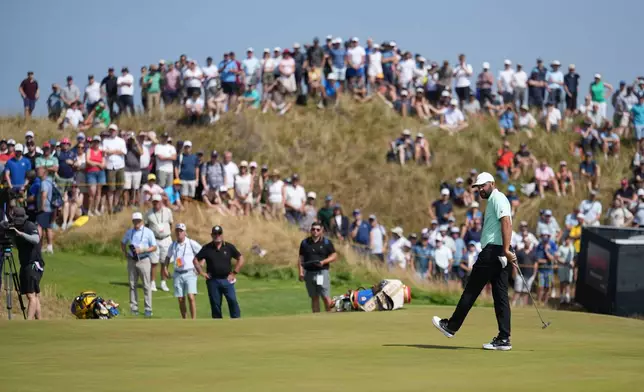 Scottie Scheffler of the United States reacts after putting on the 6th green during the first day of the British Open Golf championships at Royal Birkdale golf club, in Southport, England, Thursday, July 16, 2026. (AP Photo/Jon Super)
