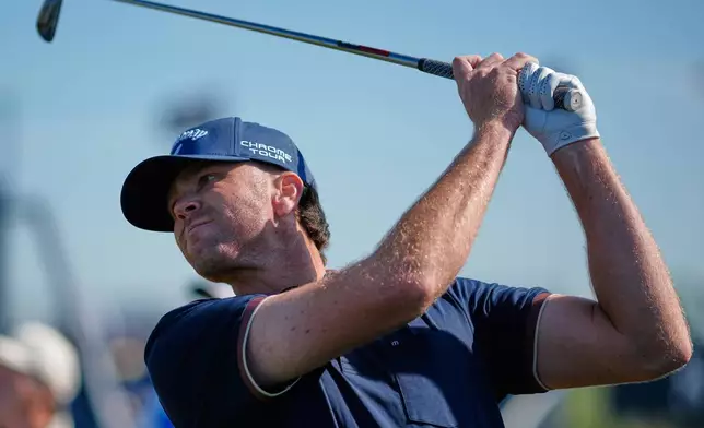 Marcus Plunkett of the United States plays a shot on the 11th tee on the arduring a practice round for the British Open Golf championships at Royal Birkdale golf club, in Southport, England, Tuesday, July 14, 2026. (AP Photo/David Goldman)