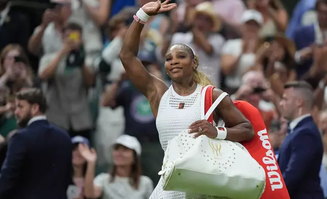 Serena Williams of the United States greets the audience as she leaves after losing to Maya Joint of Australia in their first round women's singles match at the Wimbledon Tennis Championships in London, Tuesday, June 30, 2026. (AP Photo/Maja Smiejkowska)