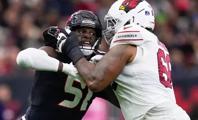 FILE - Houston Texans defensive end Will Anderson Jr. (51) is blocked by Arizona Cardinals offensive tackle Demontrey Jacobs (66) during the first half of an NFL football game, Dec. 14, 2025, in Houston. (AP Photo/Eric Christian Smith, File)