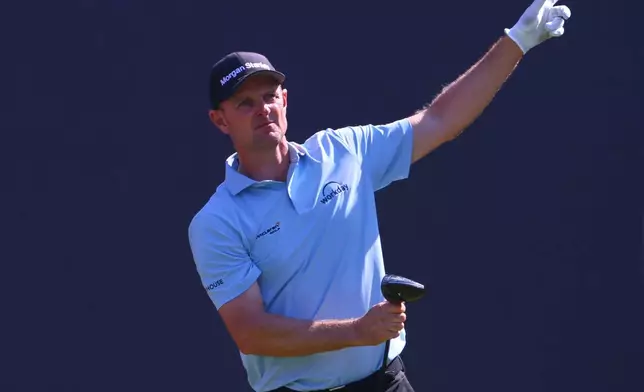 Justin Rose of England gestures that his shot from the 1st tee has gone left, during a practice round for the British Open Golf championships at Royal Birkdale golf club, in Southport, England, Tuesday, July 14, 2026. (AP Photo/Peter Morrison)