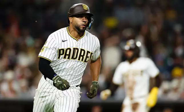 San Diego Padres' Xander Bogaerts runs the bases after hitting a two-RBI single against the Arizona Diamondbacks in the fifth inning of a baseball game Wednesday, July 8, 2026, in San Diego. (AP Photo/Derrick Tuskan)