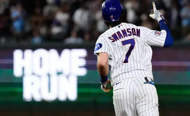 Chicago Cubs' Dansby Swanson celebrates as he rounds the bases after hitting a two-run home run during the fifth inning of a baseball game against the San Diego Padres in Chicago, Tuesday, June 30, 2026. (AP Photo/Nam Y. Huh)