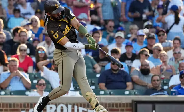 San Diego Padres' Fernando Tatis Jr. hits a solo home run during the first inning of a baseball game against the Chicago Cubs in Chicago, Tuesday, June 30, 2026. (AP Photo/Nam Y. Huh)