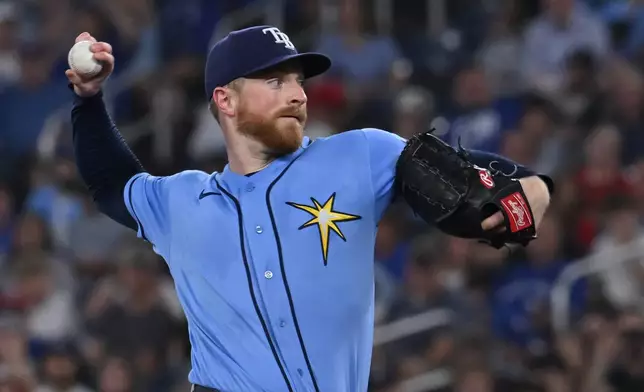 Tampa Bay Rays starting pitcher Drew Rasmussen throws to a Toronto Blue Jays batter during the first inning of a baseball game in Toronto on Tuesday, July 21, 2026. (Jon Blacker/The Canadian Press via AP)