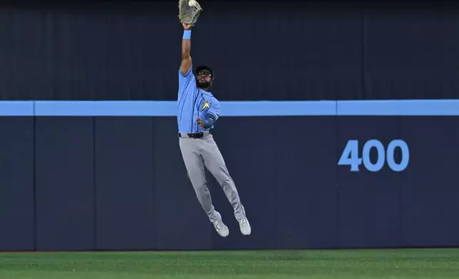 Tampa Bay Rays centre fielder Cedric Mullins (31) fields a ball off the bat of Toronto Blue Jays' Ernie Clement for a single during the first inning of a baseball game in Toronto on Tuesday, July 21, 2026. (Jon Blacker/The Canadian Press via AP)