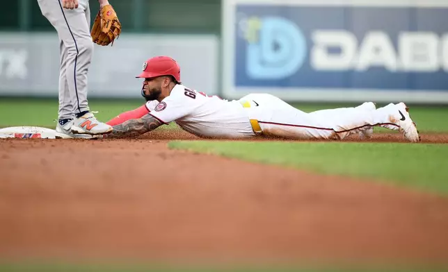 Washington Nationals' Luis Garcia Jr. steals second base during the third inning of a baseball game against the Houston Astros, Wednesday, July 8, 2026, in Washington. (AP Photo/Nick Wass)