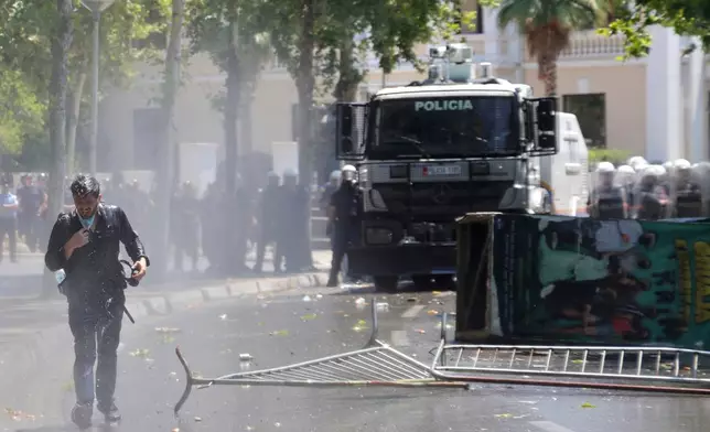 Police use a water cannon during clashes at an anti-government rally in Tirana, Albania, Thursday, July 2, 2026. (AP Photo/Hameraldi Agolli)