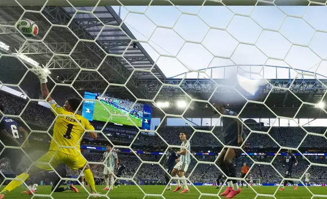 Cape Verde goalkeeper Vozinha (1) is scored on by Argentina's Lisandro Martinez during the World Cup round of 32 soccer match between Argentina and Cape Verde in Miami Gardens, Fla., Friday, July 3, 2026. (AP Photo/Lynne Sladky)