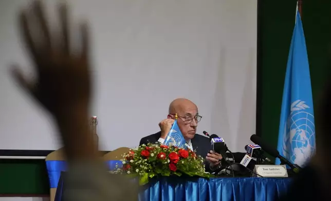 U.N. Special Rapporteur on the situation of human rights Tom Andrews, right, listens to a question during a press conference in Phnom Penh Cambodia, Friday, July 31, 2026. (AP Photo/Heng Sinith)