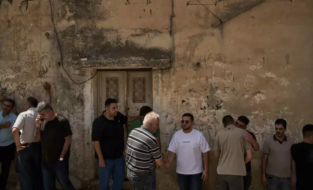 People gather to offer condolences to the families of Palestinians killed by Israeli forces the previous day in the village of Tell, near the West Bank city of Nablus, Saturday, July 25, 2026. (AP Photo/Leo Correa)