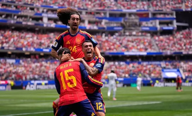 Spain's Pedro Porro(12) celebrates scoring his side's second goal against Austria with teammates during the World Cup round of 32 soccer match in Inglewood, Calif., near Los Angeles, Thursday, July 2, 2026. (AP Photo/Mark J. Terrill)
