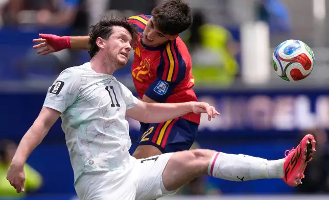 Austria's Michael Gregoritsch (11) and Spain's Pau Cubarsi go for a header during the World Cup round of 32 soccer match in Inglewood, Calif., near Los Angeles, Thursday, July 2, 2026. (AP Photo/Mark J. Terrill)