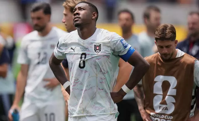 Austria's David Alaba (8) and teammates react after the World Cup round of 32 soccer match between Spain and Austria in Inglewood, Calif., near Los Angeles, Thursday, July 2, 2026. (AP Photo/Jae C. Hong)