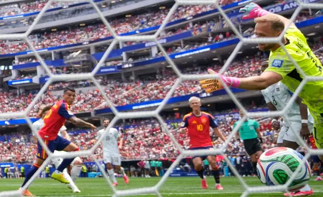 Spain's Pedro Porro (12) scores their second goal during the World Cup round of 32 soccer match between Spain and Austria in Inglewood, Calif., near Los Angeles, Thursday, July 2, 2026. (AP Photo/Mark J. Terrill)