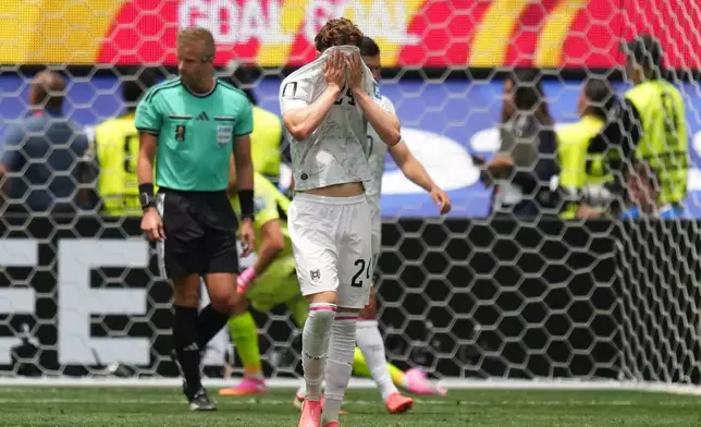 Austria's Paul Wanner covers his face after Spain's Pedro Porro scored his side's second goal during a World Cup round of 32 soccer match in Inglewood, Calif., near Los Angeles, Thursday, July 2, 2026. (AP Photo/Andre Penner)