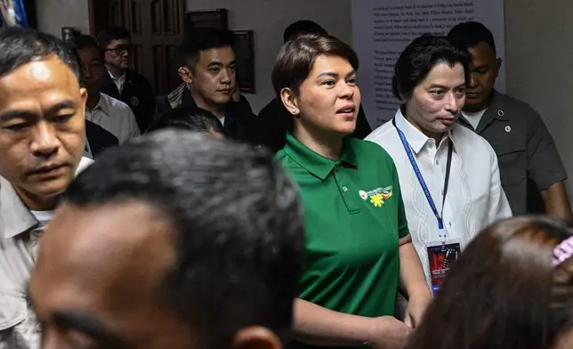 Philippine Vice President Sara Duterte, center, arrives before the start of the impeachment trial at the Senate of the Philippines in Pasay, Philippines Tuesday, July 7, 2026. (Noel Celis/Pool Photo via AP)