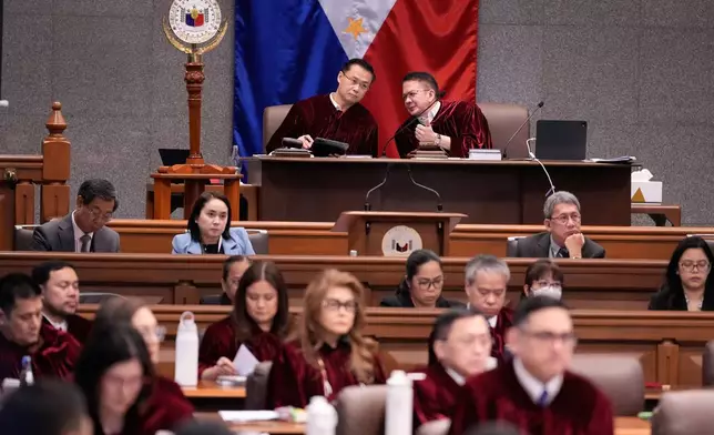 Philippine Senate President Win Gatchalian, ltop eft, and Presiding Officer Francis Escudero talk during the impeachment trial of Philippine Vice President Sara Duterte at the Philippine Senate in Pasay city, Philippines on Tuesday, July 7, 2026. (AP Photo/Aaron Favila, Pool)