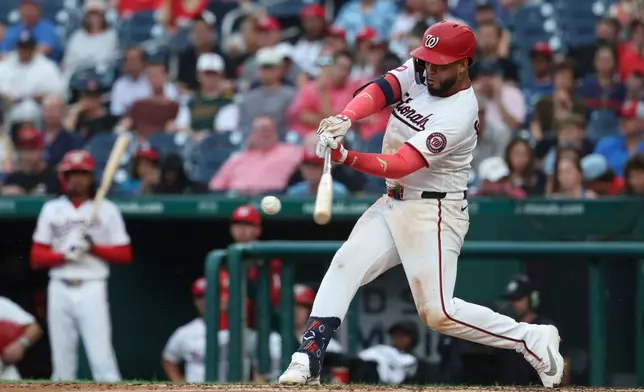 Washington Nationals' Luis García Jr. hits a single off Houston Astros pitcher Tatsuya Imai during the third inning of a baseball game, Tuesday, July 7, 2026, in Washington. (AP Photo/Terrance Williams)