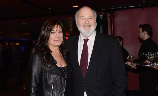 FILE - Actor Rob Reiner and his wife, Michele Singer, arrive for an event on Dec. 17, 2013, in New York. (Photo by Evan Agostini/Invision/AP, File)