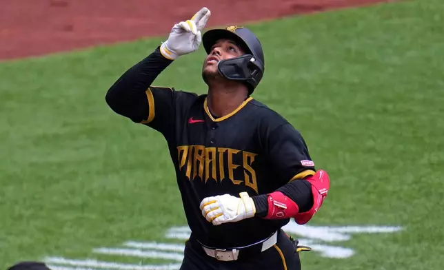 Pittsburgh Pirates' Esmerlyn Valdez celebrates as he rounds the bases after hitting a solo home run off Milwaukee Brewers pitcher Brandon Sproat during the third inning of the first game of a baseball double header in Pittsburgh, Saturday, July 11, 2026. (AP Photo/Gene J. Puskar)