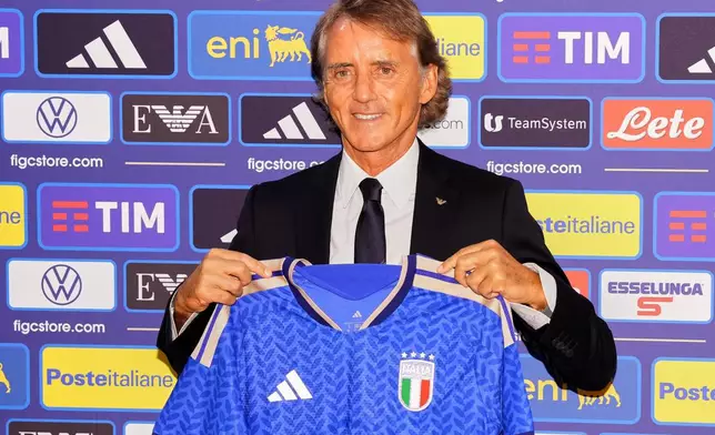 Italy's new national soccer team coach Roberto Mancini pose during a news conference, Wednesday July 29, 2026, in Rome. (Alfredo Falcone/LaPresse via AP)