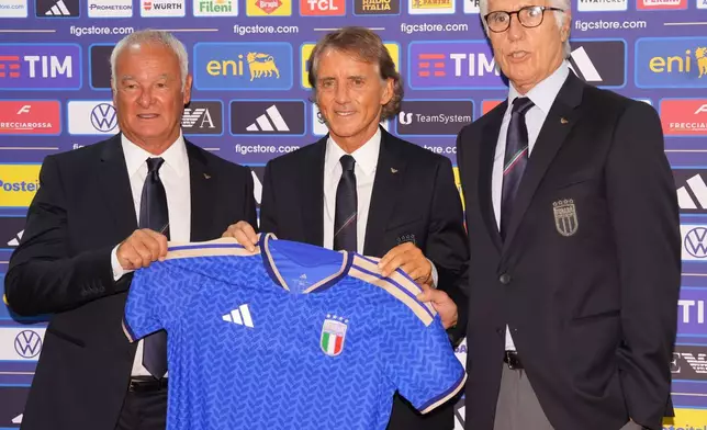Giovanni Malago, right, present Italy's new national soccer team coach Roberto Mancini, center, and new technical director Claudio Ranieri during a news conference, Wednesday, July 29, 2026, in Rome. (Alfredo Falcone/LaPresse via AP)