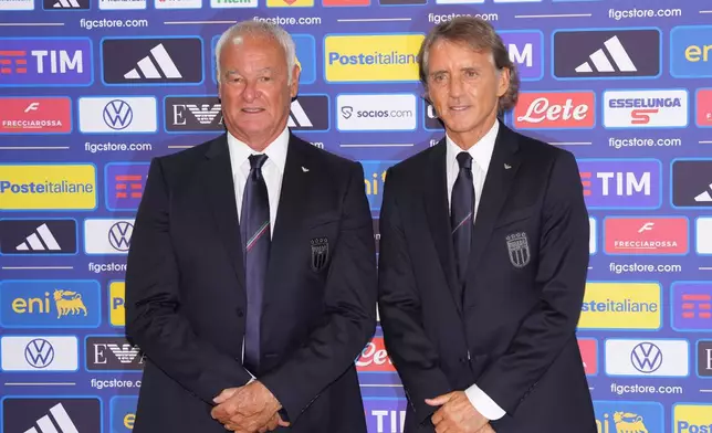 Italy's new national soccer team coach Roberto Mancini, right, and new technical director Claudio Ranieri pose during a news conference, Wednesday July 29, 2026, in Rome. (Alfredo Falcone/LaPresse via AP)