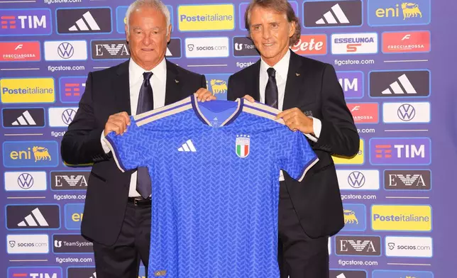Italy's new national soccer team coach Roberto Mancini, right, and new technical director Claudio Ranieri pose during a news conference, Wednesday July 29, 2026, in Rome. (Alfredo Falcone/LaPresse via AP)